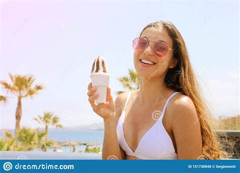 Girl Eating Ice Cream On Tenerife Beach With Palm Trees On The