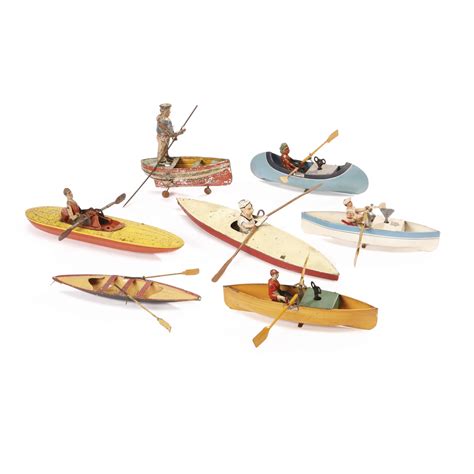 23 Collection Of Seven Rowing Toys Early 20th Century