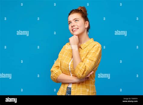 Red Haired Teenage Girl Looking Up And Dreaming Stock Photo Alamy