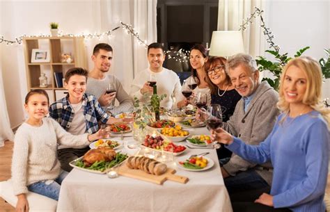 Get the recipe ideas on food & wine. Happy Family Having Dinner Party At Home Stock Photo ...
