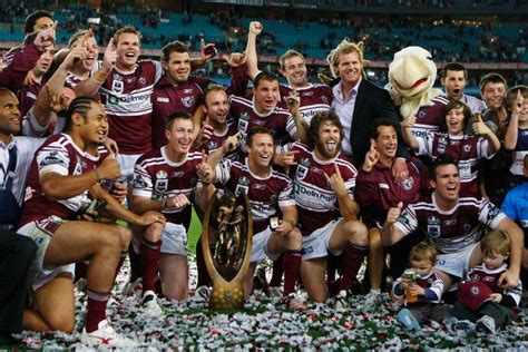 Manly Sea Eagles Players Celebrate With The Trophy After Winning The