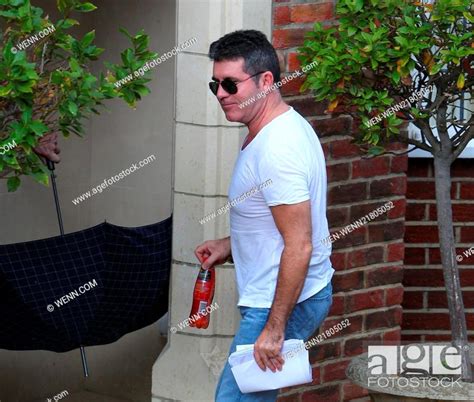 Simon Cowell Arrives To Visit The X Factor Finalists At The House On His 55th Birthday Featuring