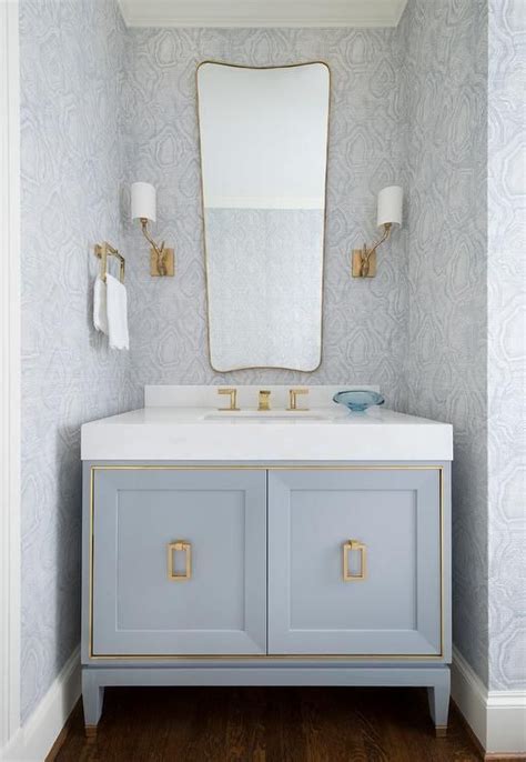 Elegant Powder Room Designed With A Blue French Washstand Accented With