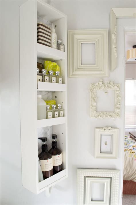 W metal bathroom wall shelf in oil rubbed bronze. 15 Exquisite Bathrooms That Make Use of Open Storage