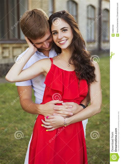 Beautiful Brunette Couple In Love Hugging On A Date In The Park Stock Image Image Of Cute