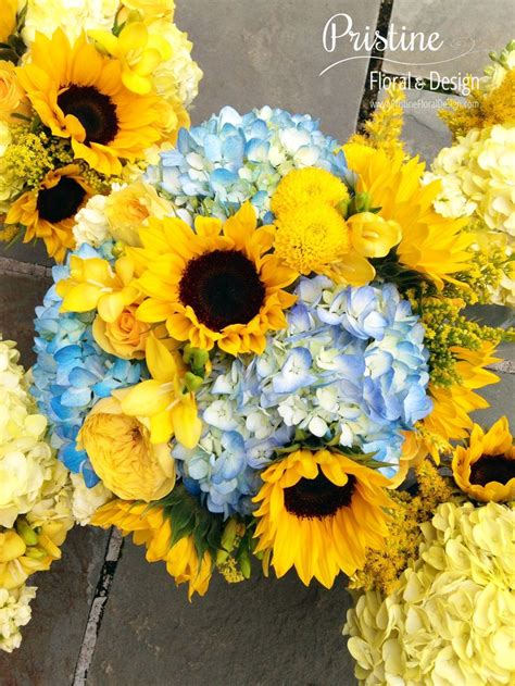Bridesmaid Bouquets Designed Using Blue Hydrangea Sunflowers Freesia