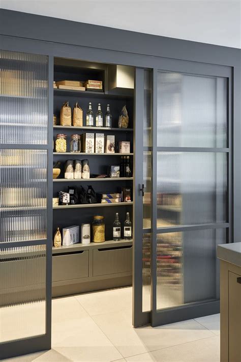 An Open Pantry With Lots Of Food Items On The Shelves And In Front Of