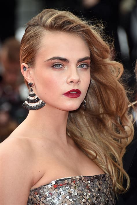 Cara Delevingne Models Light Up The Amfar Runway With Red Hot Lips