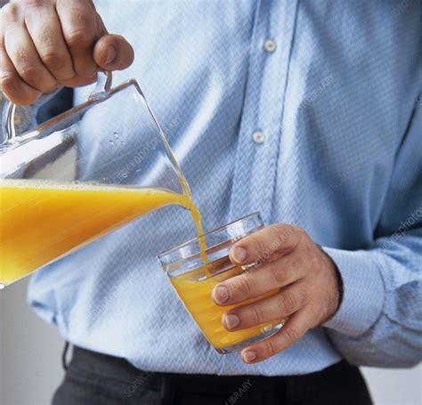 Pouring Orange Juice Stock Image P920 0493 Science Photo Library