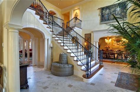 Grand Foyer With Double Grand Staircase With Beautiful Wrought Iron
