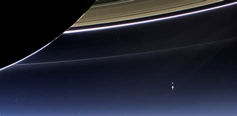 Earth Strikes A Pose Beneath Saturns Rings Abc News