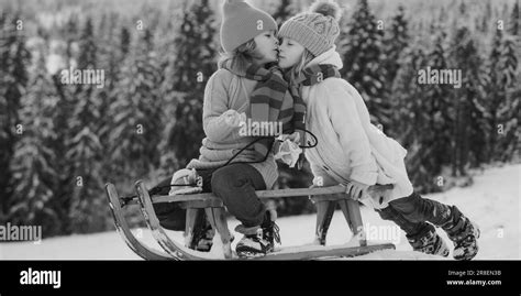 Outdoor Kids Little Boy And Girl Kiss On Winter Outdoors Happiness And