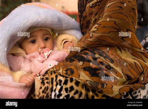 Libyan Woman Carrying Her Baby In The Medina Or Old Town Tripoli Libya