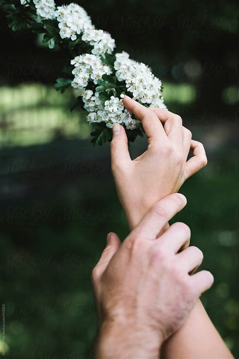 Couple Hands Holding Flowers By Stocksy Contributor Simone Wave