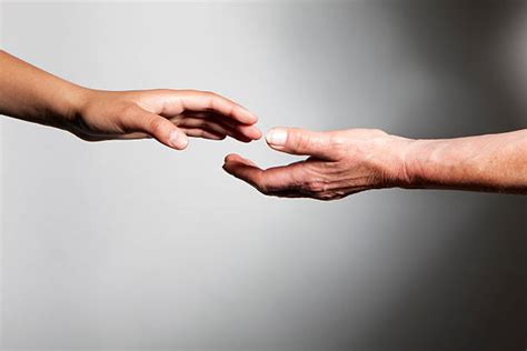 Two Hands Reaching For Each Other Stock Photos Pictures And Royalty Free