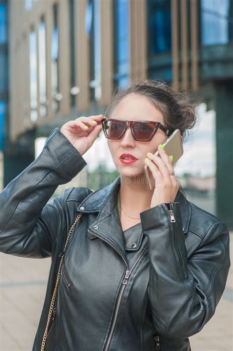Beautiful Stylish Woman In The City Talking On Mobile Phone Stock Photo