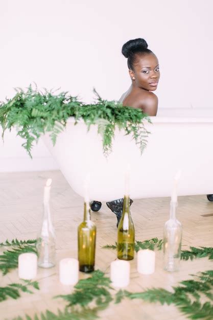 Premium Photo Woman Bathing In A Tub Full Of Foam Beautiful African