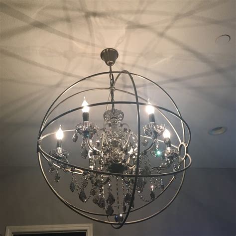These unique lights become not only a functional piece of your home, but also serves as a decorative piece to have on display from your ceiling. Foucault's Orb Crystal Chandelier | Chairish