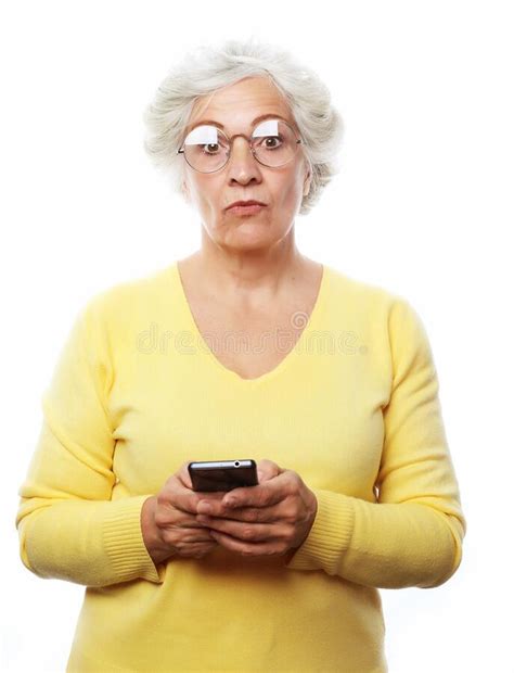 Pretty Senior Woman In Casual Outfit Using Modern Smartphone Stock