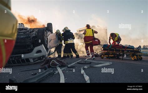 Paramedics And Firefighters Arrive On The Car Crash Traffic Accident