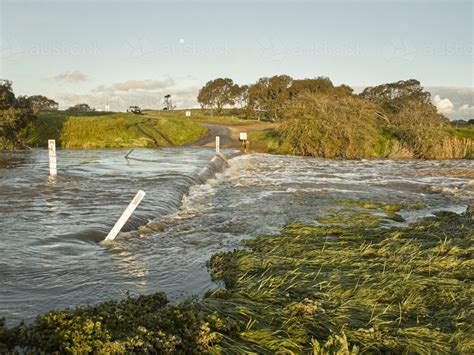 Image Of Country Road Leading Through Flooded Causeway Austockphoto