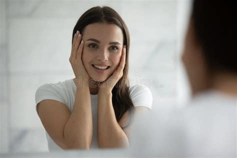 Excited Female Admiring Her Face After Course Of Beauty Procedures