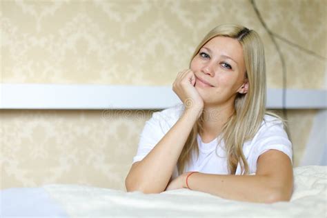 Charming Blonde Smiles And Poses For Camera Located In Sleeping Stock
