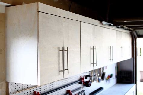 This is what me and hubby came up with. How to Build a DIY Wall Mounted Garage Cabinets - TheDIYPlan