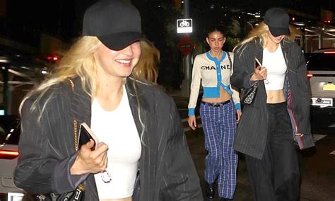 Beaming Gigi Hadid Flashes Her Washboard Abs In A White Crop Top And Low Rise Trousers In Nyc