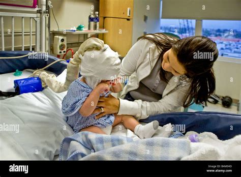 In A California Hospital A Mother Cares For Her Infant Son Suffering