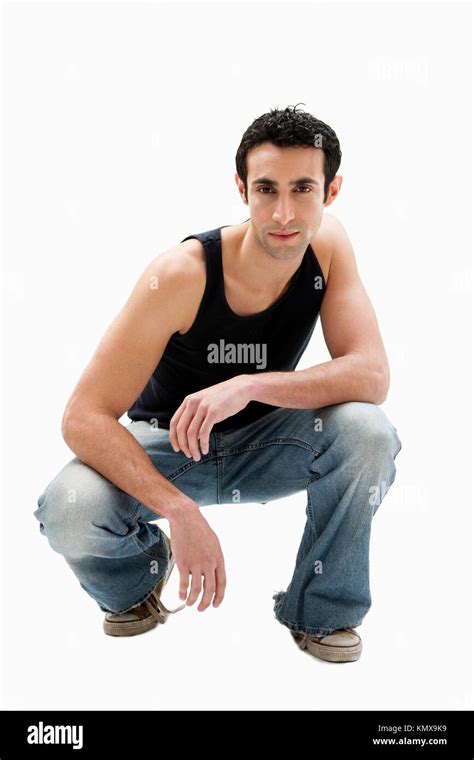 Handsome Serious Caucasian Guy Wearing Black Tank Top And Jeans