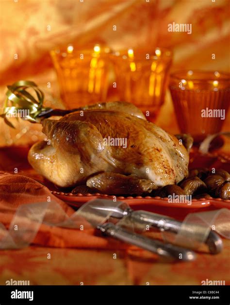 Guinea Fowl With Chestnuts Stock Photo Alamy