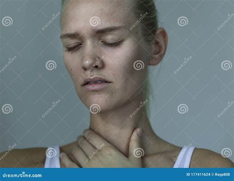 A Sick Woman With A Painful Sore Throat And Fever Flu And Virus