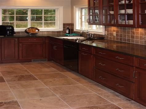 The floor tile often needs to balance the colors in the rest of the kitchen. cherry cabinets with stone linoleum flooring | Cherry ...