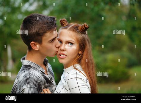 Enamoured Teens Kiss Passionately Girlfriend And Boyfriend Together