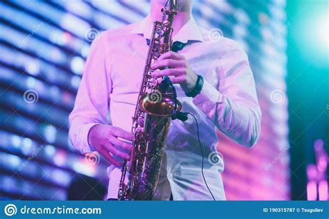 Concert View Of A Saxophonist Saxophone Player With Vocalist And