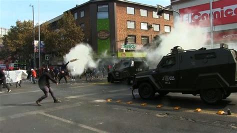Protesters Clash With Riot Police In Chilean May Day Protest