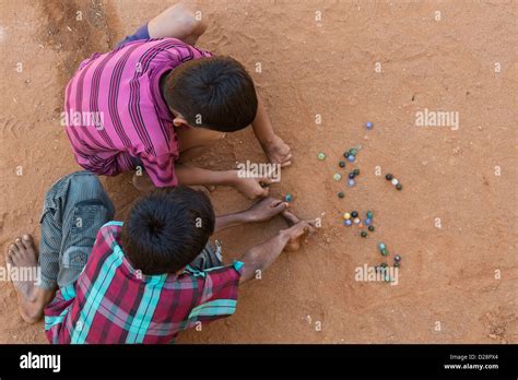 Children Playing Marbles In Street Hi Res Stock Photography And Images