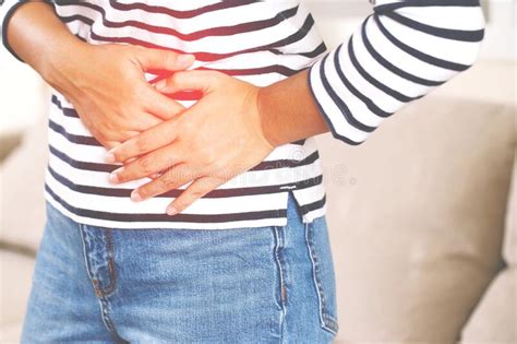 Woman Having A Stomachache Or Menstruation Pain Suffering From