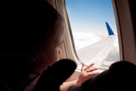Girl Looking Out Plane Window Stock Photos Pictures And Royalty Free