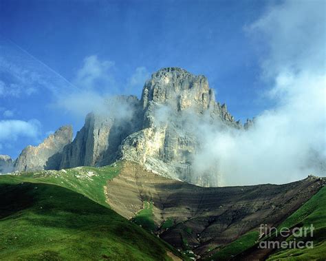 Cloud And Mist Swirling Around The Cliffs Of The Langkofel Frompasso