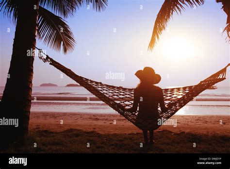 Relaxing In Hammock At Sunset On The Paradise Beach Stock Photo Alamy