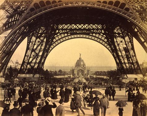 Filecrowd Of People Walking Under The Base Of Eiffel Tower View