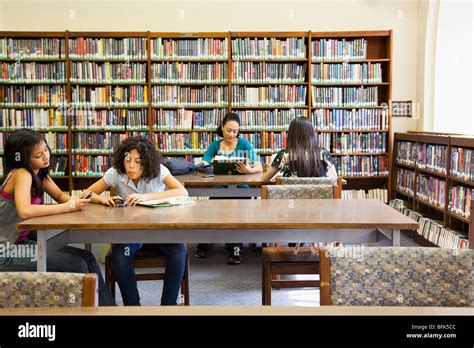 People Reading Books In Library Stock Photo Alamy