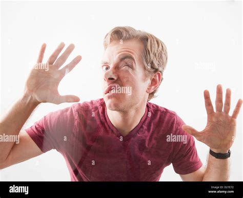 Man Pushing His Face And Hands Against Glass Stock Photo 53025254 Alamy