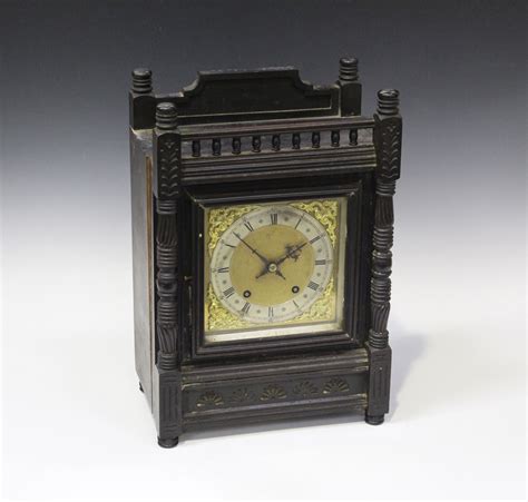 A Late 19th Century German Ebonized Walnut Mantel Clock With Eight Day Movement Striking On A Gong
