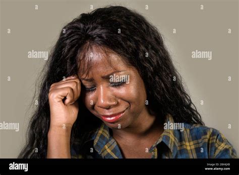 Young Sad And Depressed Black African American Woman Crying Anxious And Overwhelmed Feeling Sick
