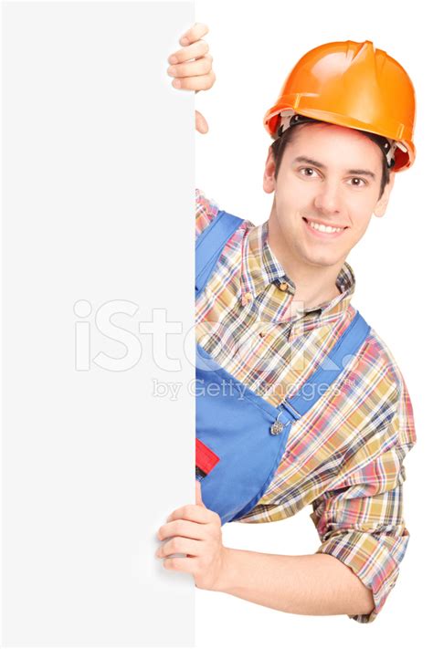 Young Construction Worker Posing Behind A Panel Stock Photo Royalty