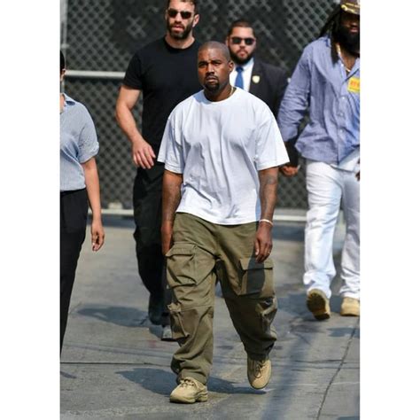 Kanye Wests Summer Fashion Wardrobe Staple Are Coats — Kolor Magazine