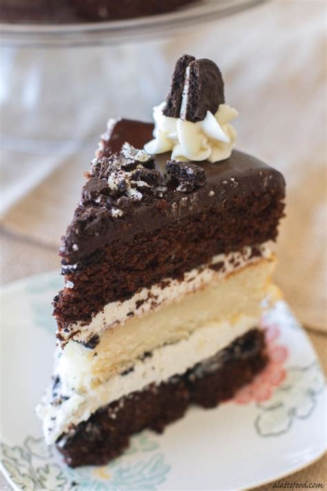 Layers Of Chocolate And Vanilla Cake Are Filled With Vanilla Frosting Crushed O